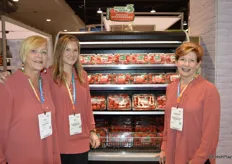 Standing in front of the cooler with organic strawberries are Kari Maggiorini, Bre Macomber and Stephanie Hilton with Tom Lange/Seven Seas.